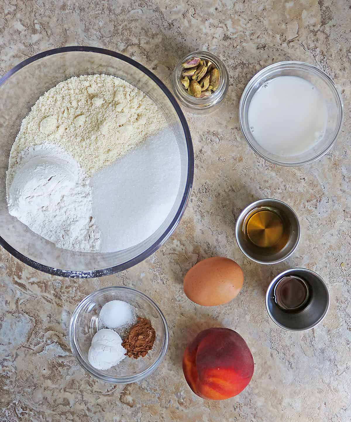 Simple ingredients to make peach pistachio muffion tops