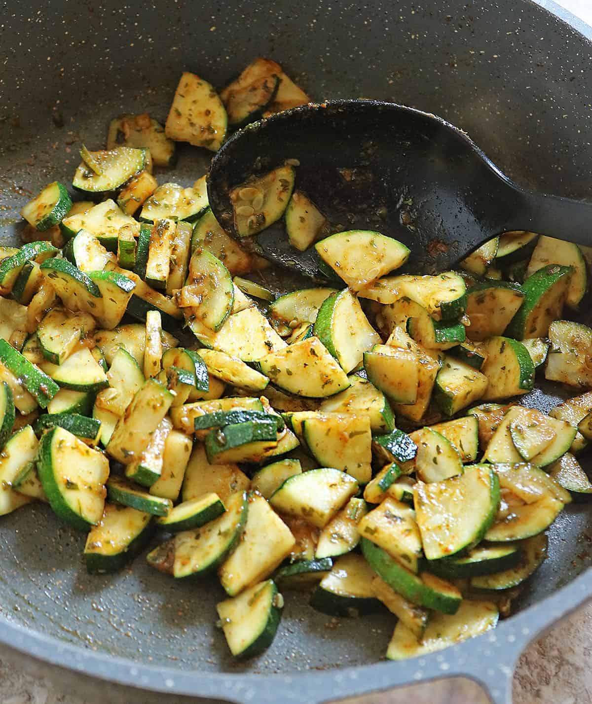 sautéing zucchini with berbere.