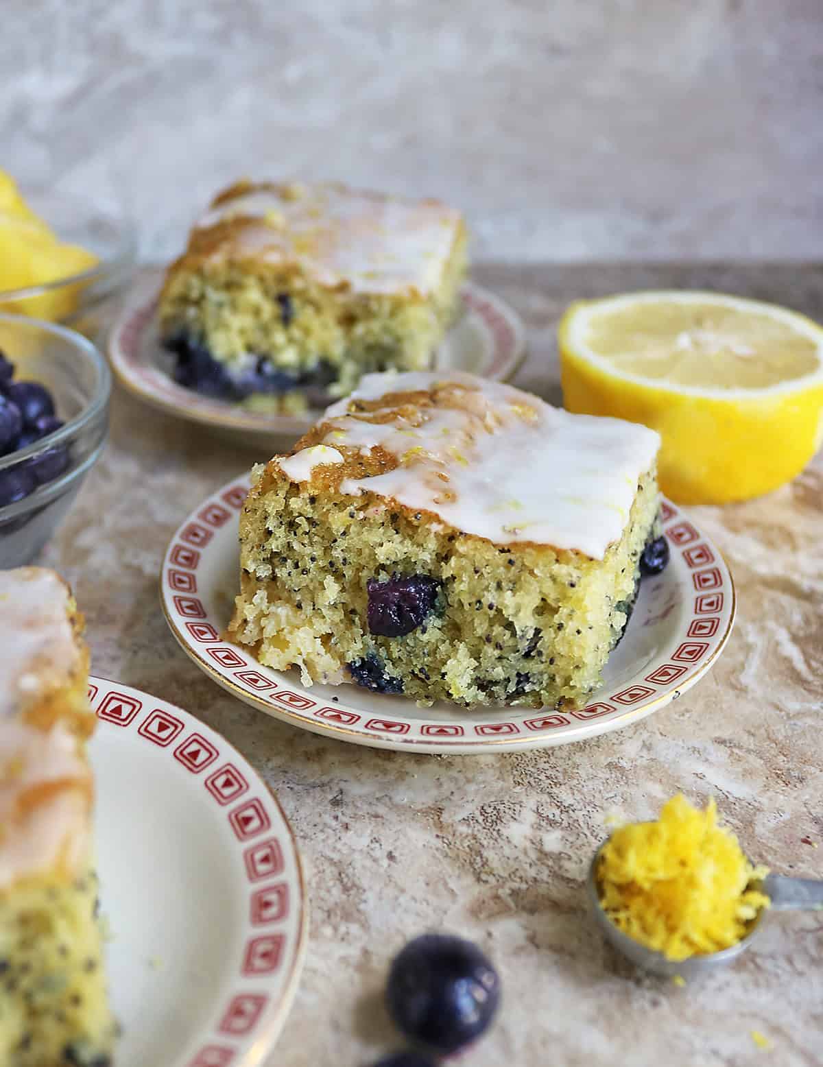 Enjoying a slice of Pineapple Blueberry Lemon Poppyseed Cake with lemon icing