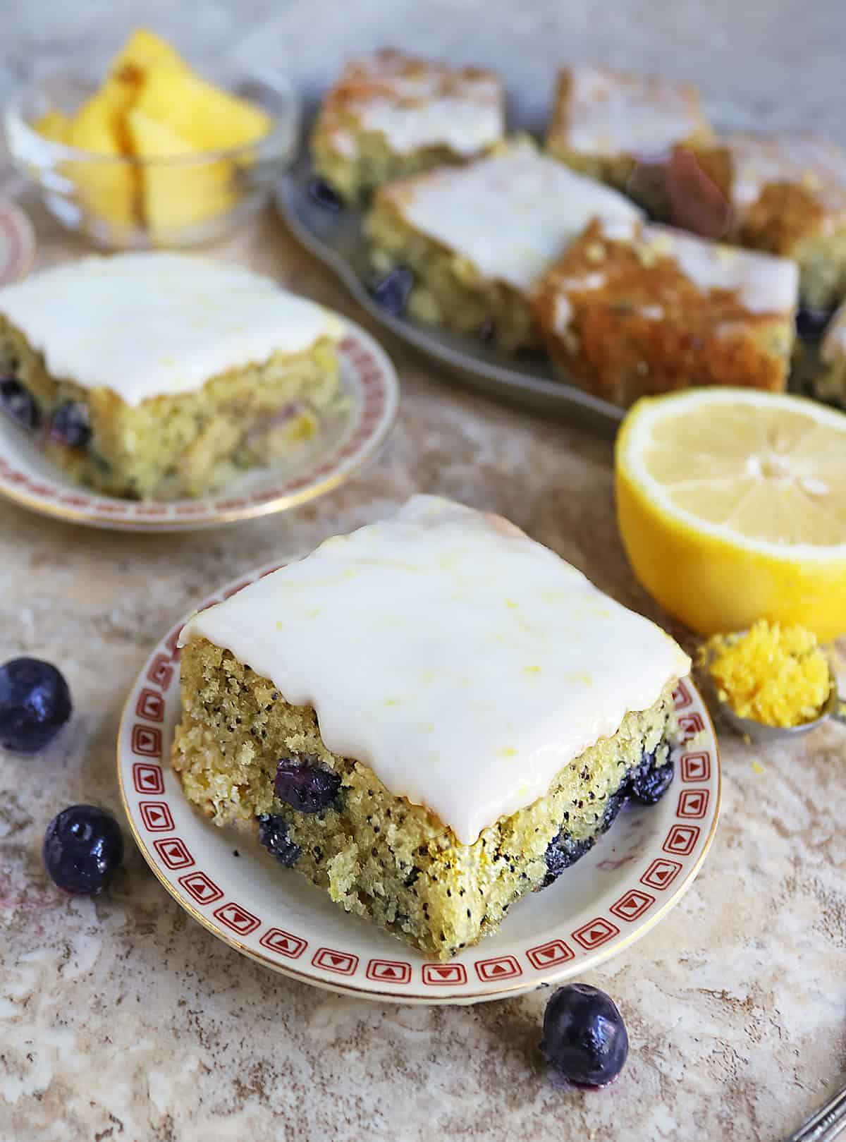 A slice of the best Pineapple Blueberry Lemon Poppyseed Cake