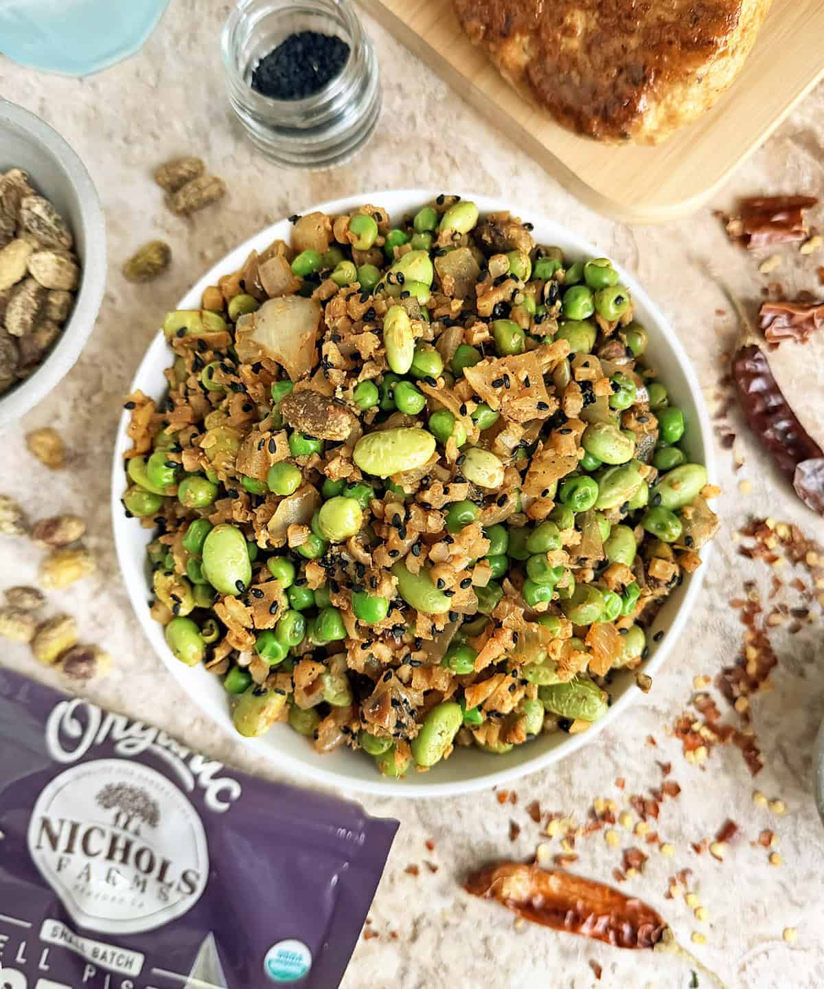 Pistachio salad with green peas, edamame, blask sesame seeds