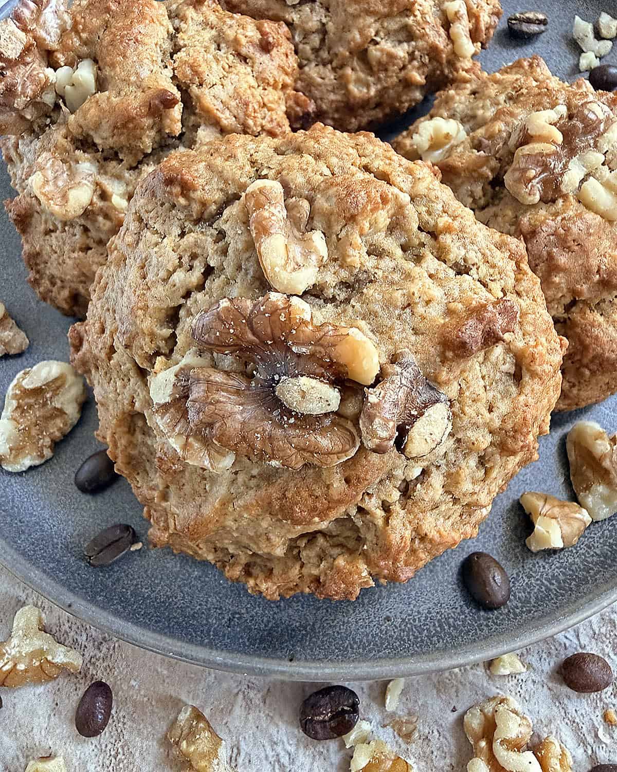 Close-up of oatmeal walnut cookies with nuts on a plate.